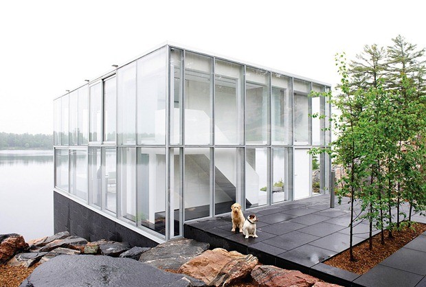 glass house with wooden patio