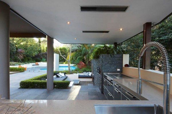 outdoor kitchen area with pool