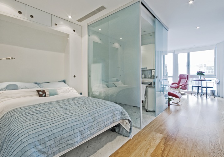 modern studio apartment with glass bathroom