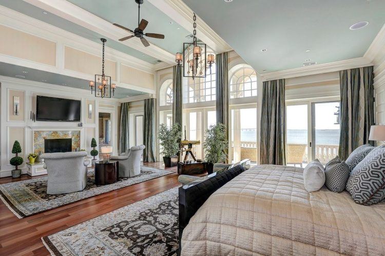 traditional master bedroom with wood flooring