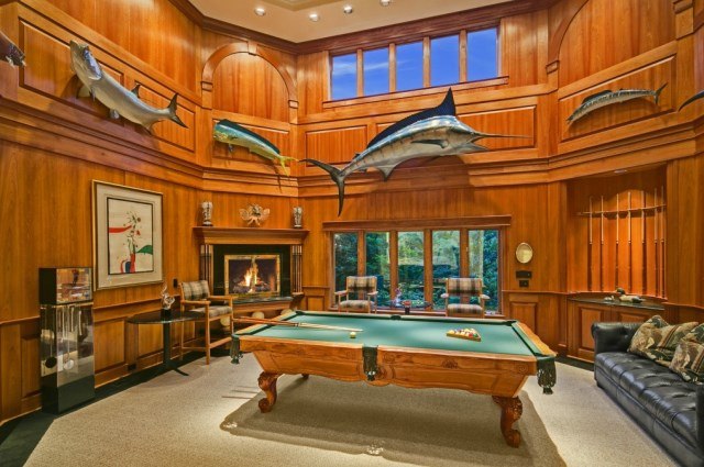 lavish pool room with wooden walls