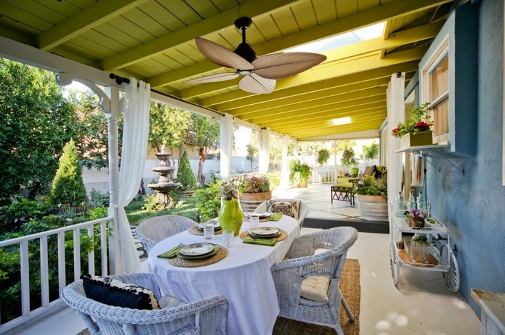 beautiful deck with ceiling fan and yellow ceiling