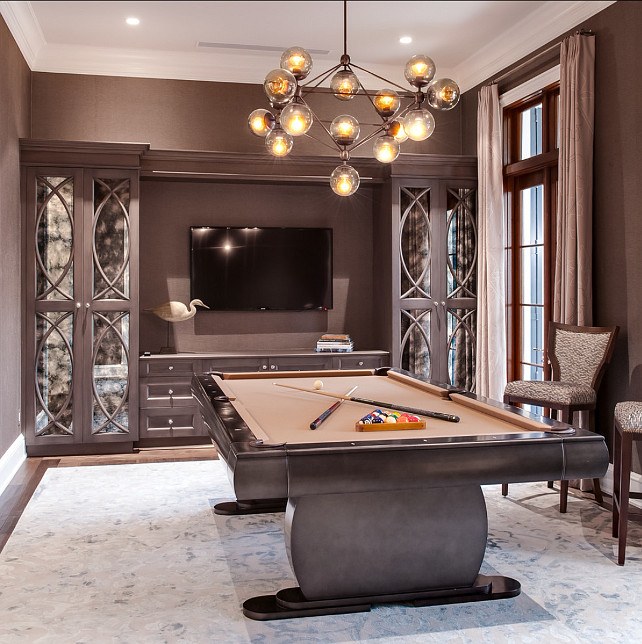 home billiards hall with modern chandelier