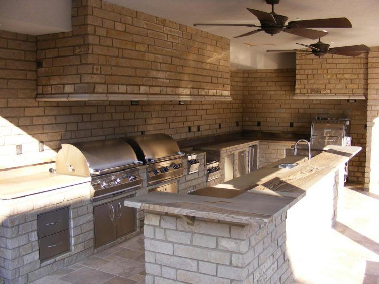 outdoor kitchen with stone island