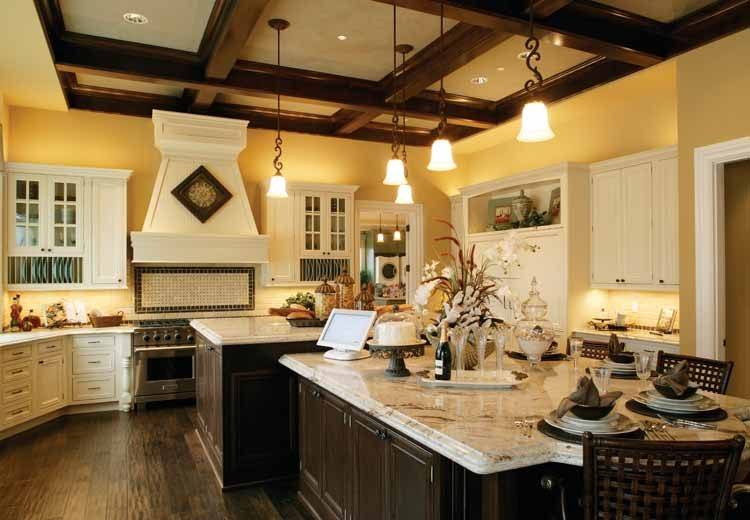 kitchen with hanging lamps and wooden beams