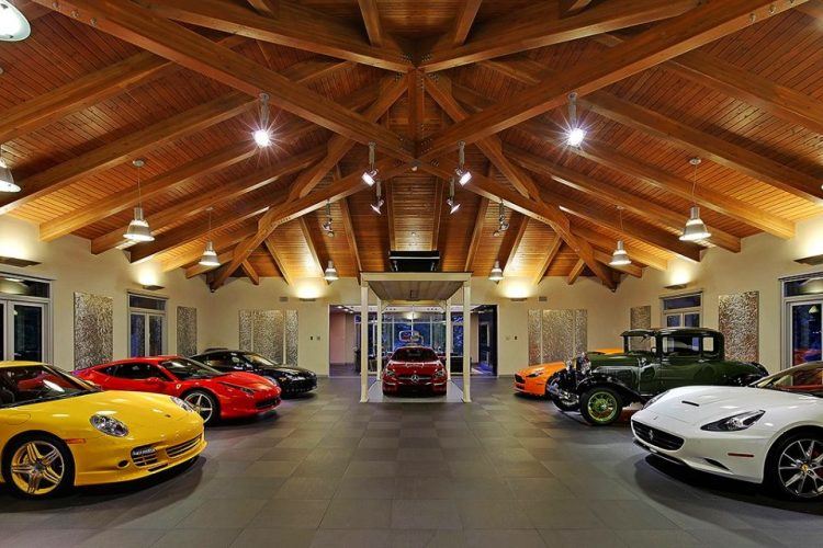 luxury car garage with vaulted ceiling