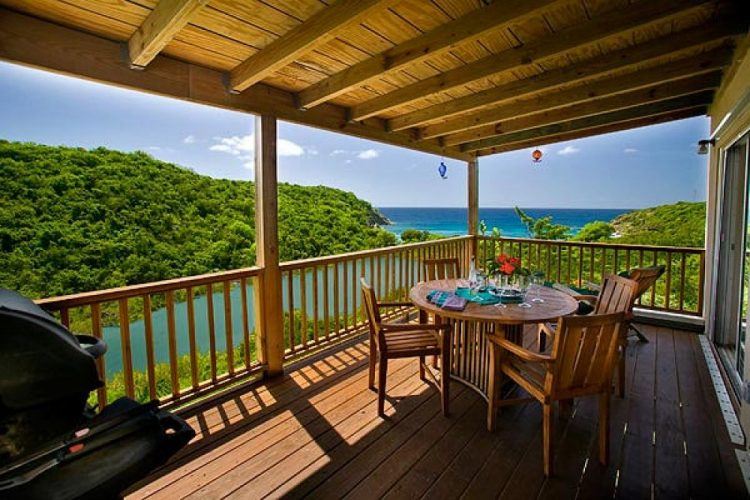 beautiful covered deck overlooking water