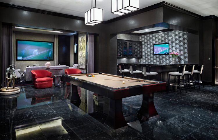 sleek modern pool room with dark decor