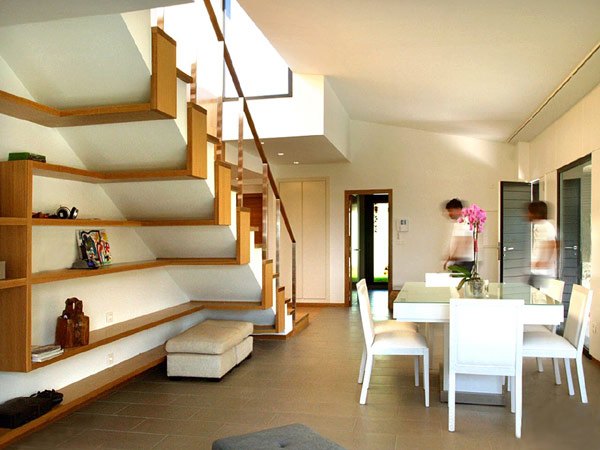 long wooden shelves under staircase