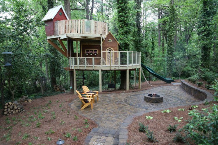 cool backyard treehouse with slide