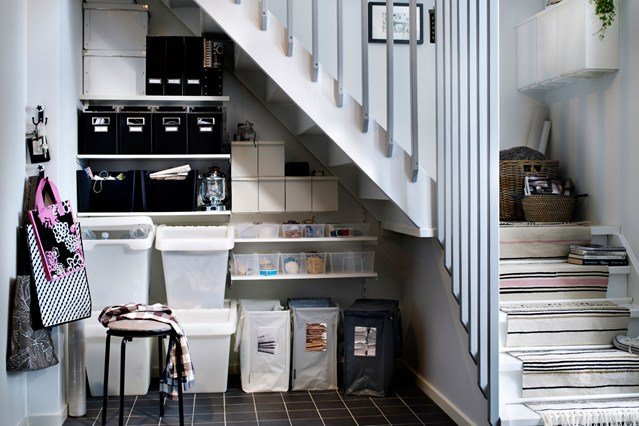 organized storage area under stairs