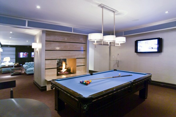 billiard room with modern fireplace