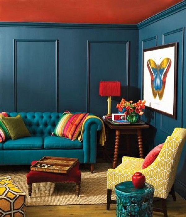 living room with deep blue paneled walls