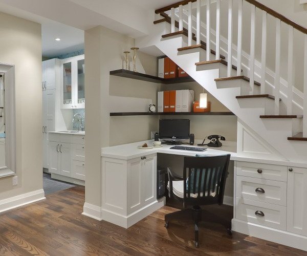 cool home office under stairs