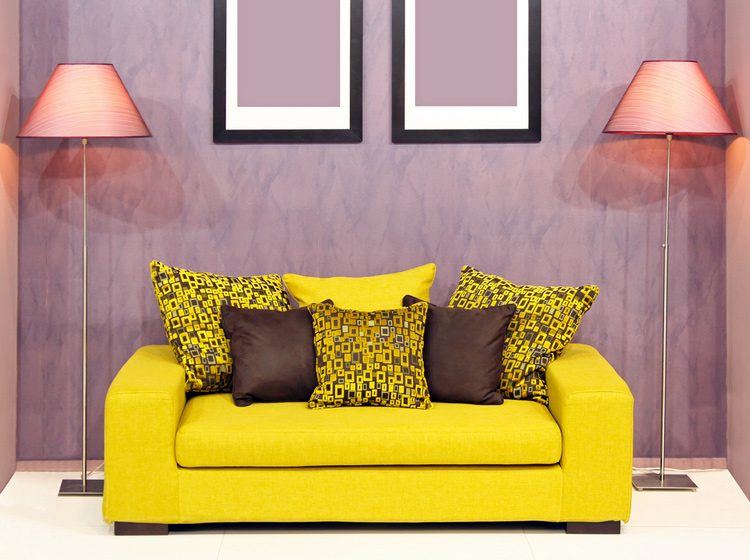 yellow couch with purple walls