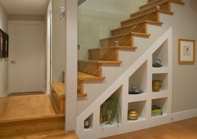 beautiful white wooden staircase with storage space