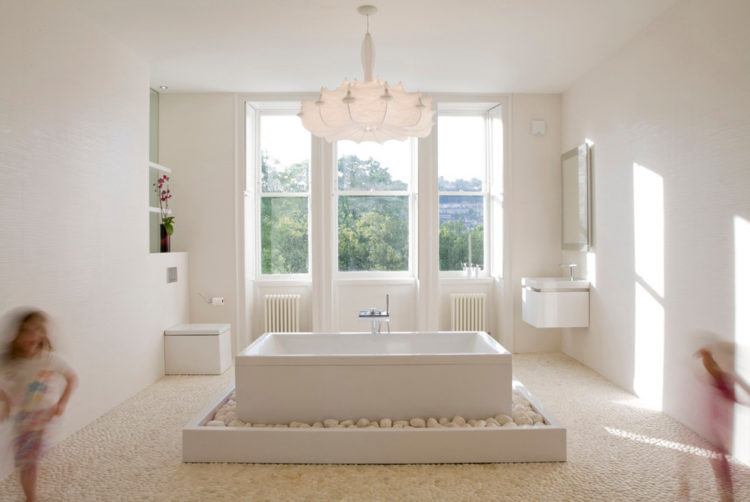 bathroom with lavish chandelier 