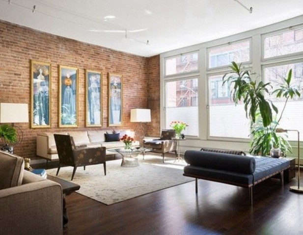 living room with brick accent wall