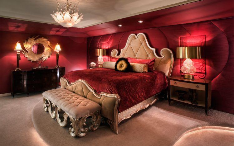 red bedroom with chandelier 