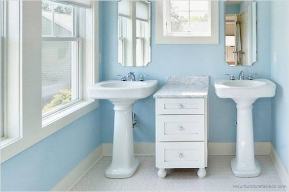 powder blue bathroom design with two pedestal sinks