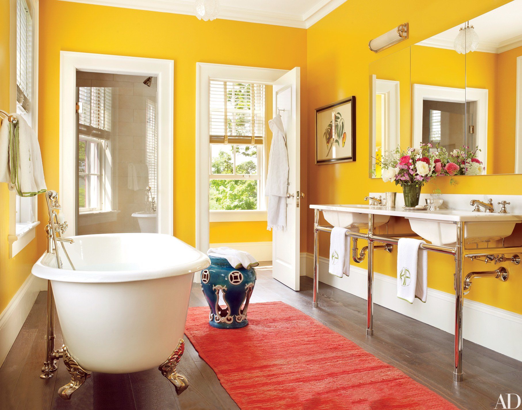 20 Vibrant Bathroom Colors To Brighten Your Space - Vibrant Colorful Bathroom With Yellow Walls AnD Claw Foot Bathtub