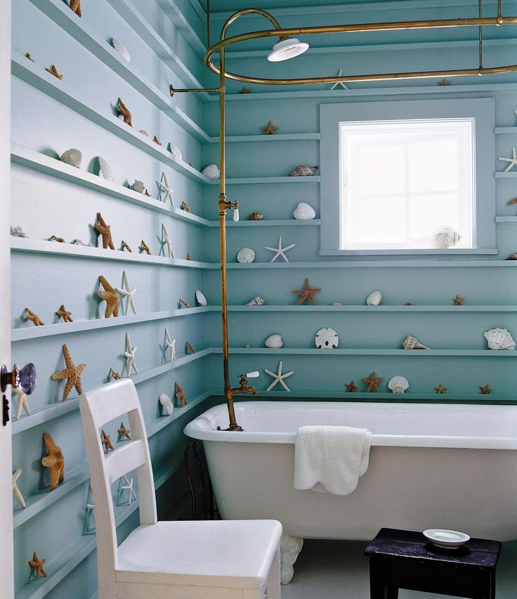 bathroom with shelves full of seashells