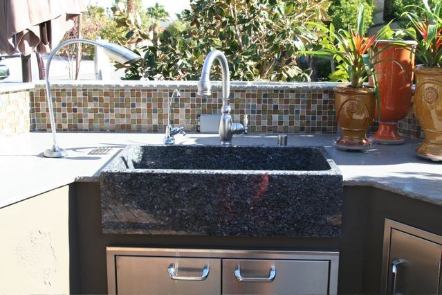 outdoor kitchen with sink made of stone