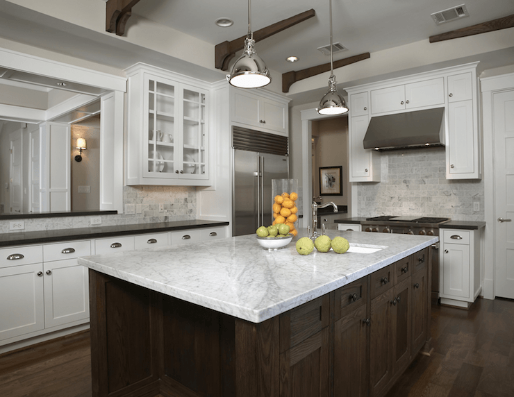 large wooden island with carrara marble countertop