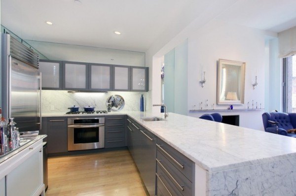 carrera-marble-kitchen-countertops-with-undermount-bar-sink-above-euro-style-drawer-pulls-by-wooden-storage-cabinets-on-light-grey-paint-colors-600x399