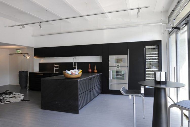 spacious modern kitchen with gray flooring