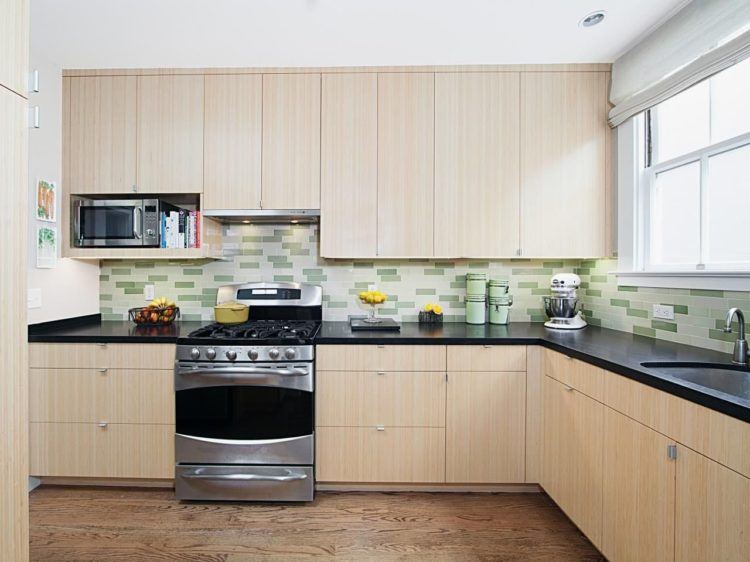 modern kitchen with light wood cabinets