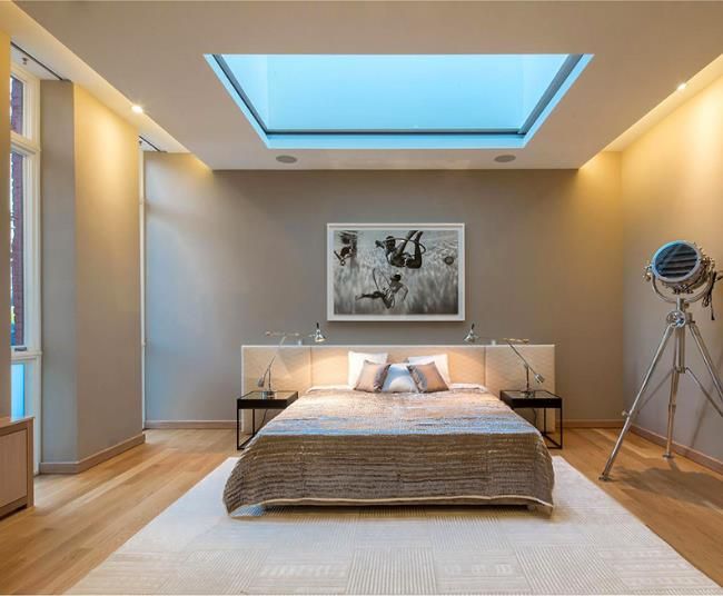 bedroom with square skylight