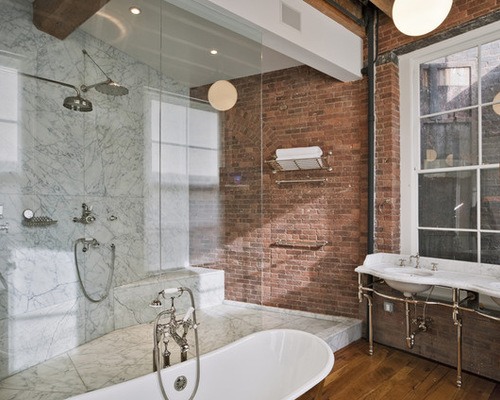 shower with brick accent wall