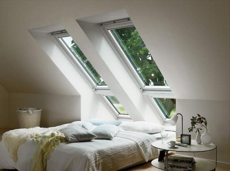 beautiful simple bedroom with two skylights