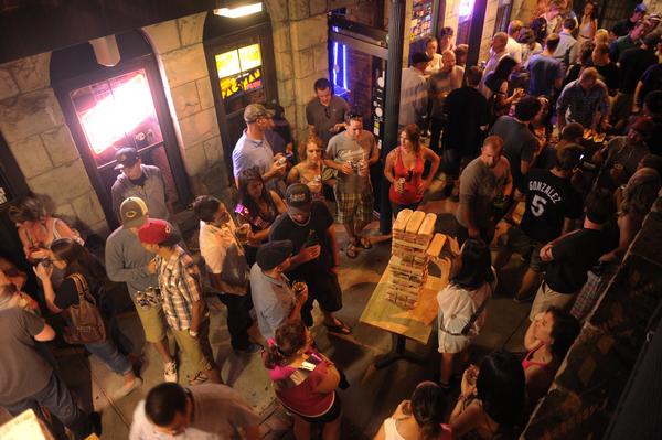 DENVER, CO. - JULY 21:  Young people packed the 1 Up Arcade and Tavern early Sunday morning, July 21, 2013.  All Denver bars are required to shut their doors at 2 a.m. The resulting flood of humanity back onto the streets sometimes lead to problems.  Photo By Karl Gehring/The Denver Post