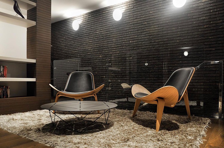 living room with beautiful black brick wall