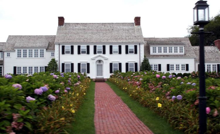 colonial house with brick walkway