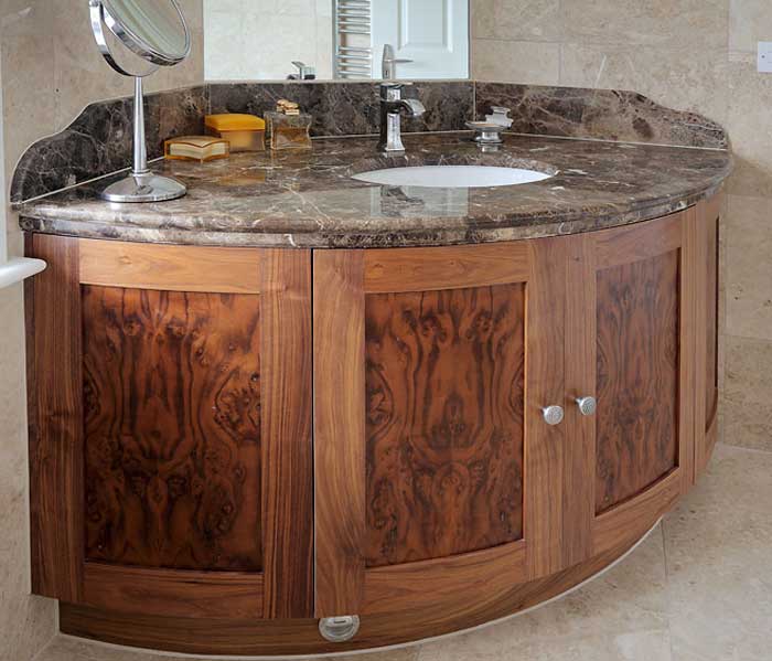 bathroom vanity with marble counter top