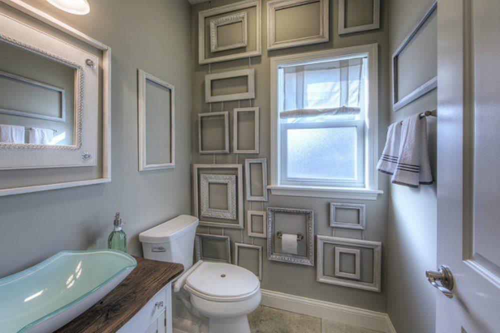 bathroom with gallery wall of frames