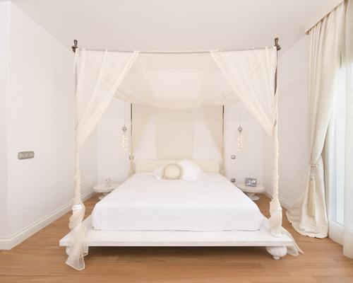 minimalist bedroom with canopy bed