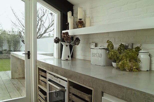 beautiful farmhouse style kitchen with concrete counter