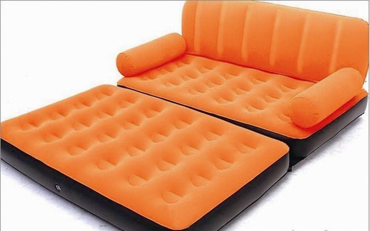 instable orange sofa with foot rest