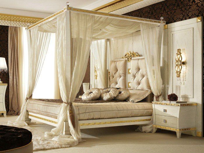 lavish canopy bed with decorative pillows