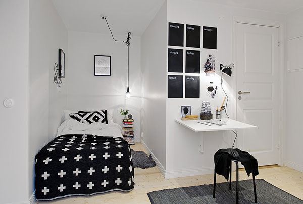 small bedroom with black and white design