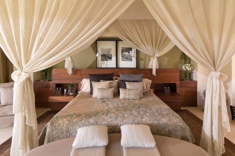 canopy bed with large white curtain