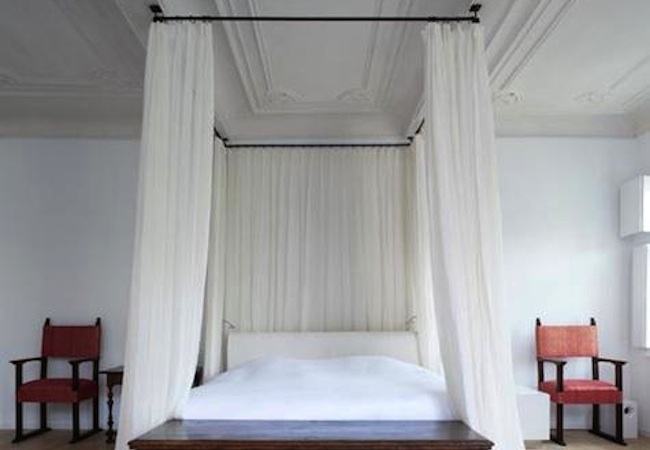 lovely simple canopy bed with white curtain