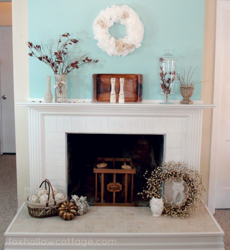 fireplace with decor on mantel and floor