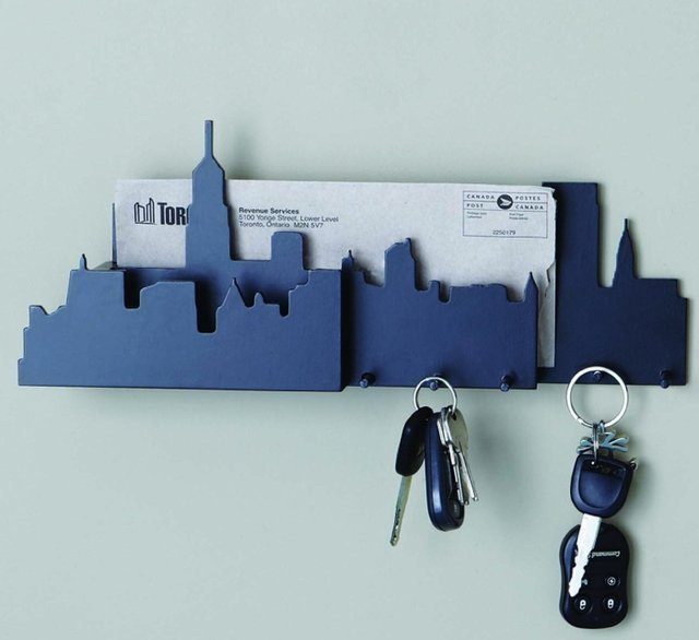 blue wall key holder with cityscape