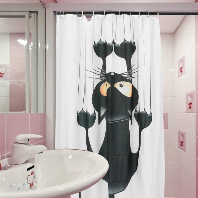 cat hanging on shower curtain