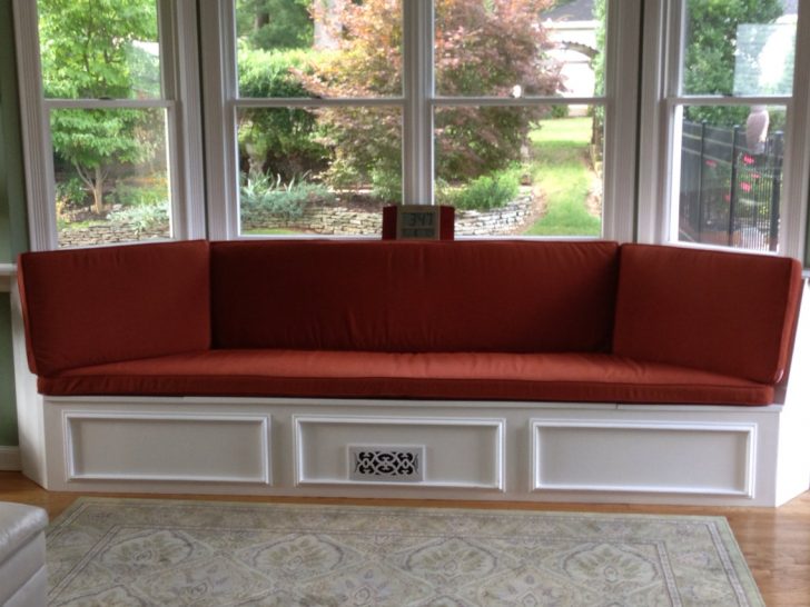 bay window seat with red cushion 